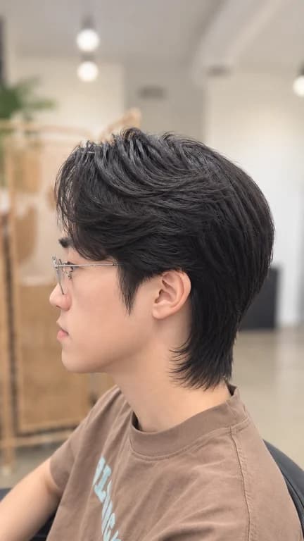 Stylish layered haircut with textured finish and natural movement.