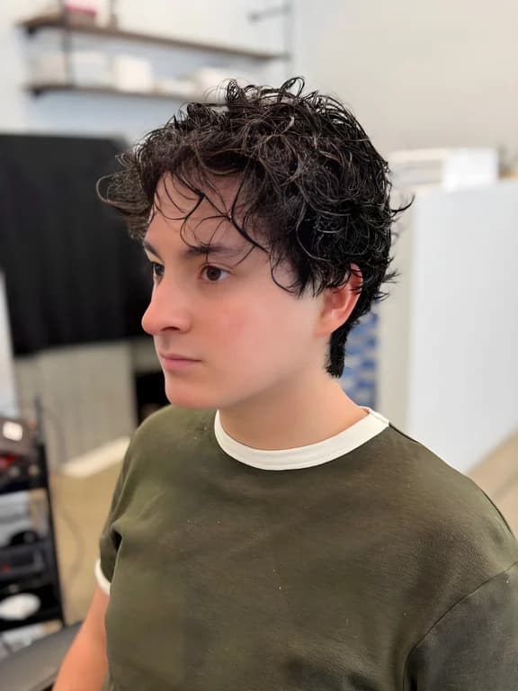 Natural textured curls styled for a fresh look.